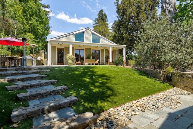 view of front of house with a patio, a front lawn, and ceiling fan