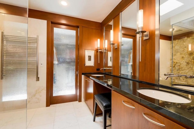 bathroom featuring radiator heating unit and vanity