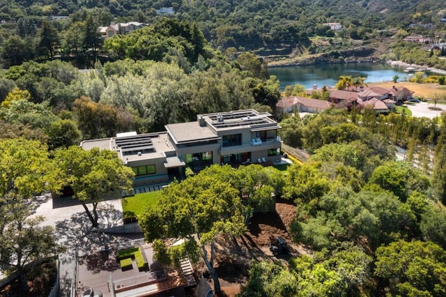 birds eye view of property with a water view