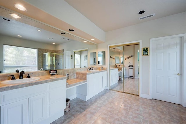 bathroom featuring tile floors, double sink, and large vanity