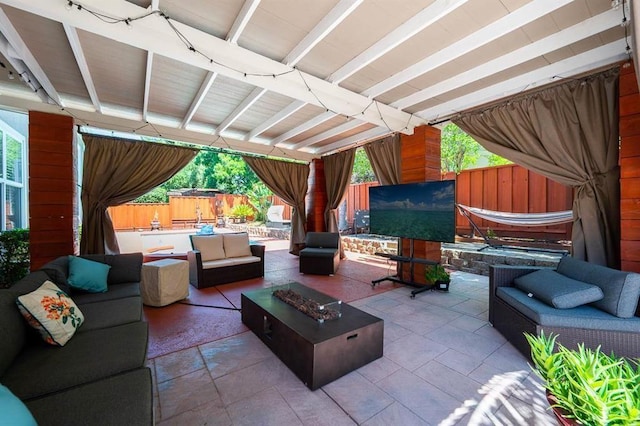 view of patio / terrace with an outdoor living space with a fire pit