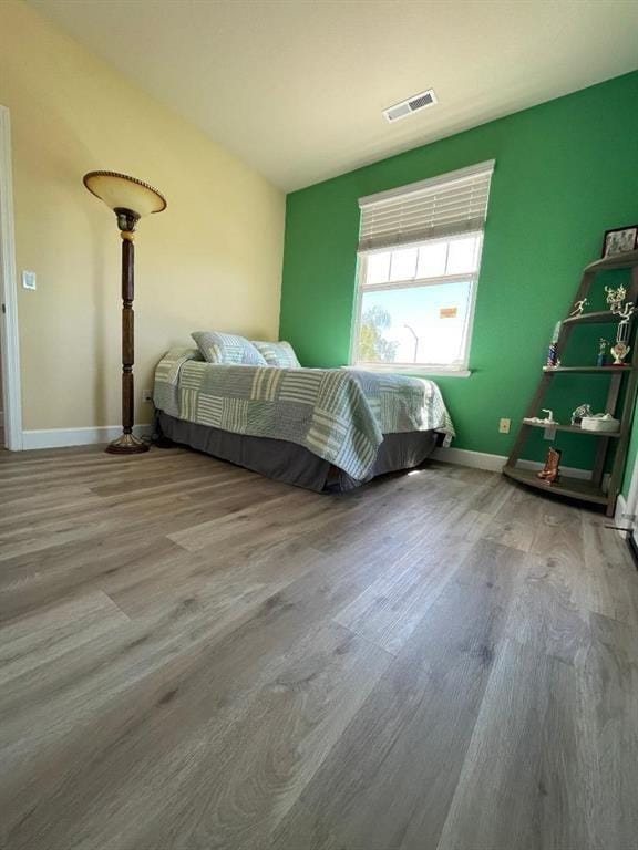 bedroom with light wood-type flooring