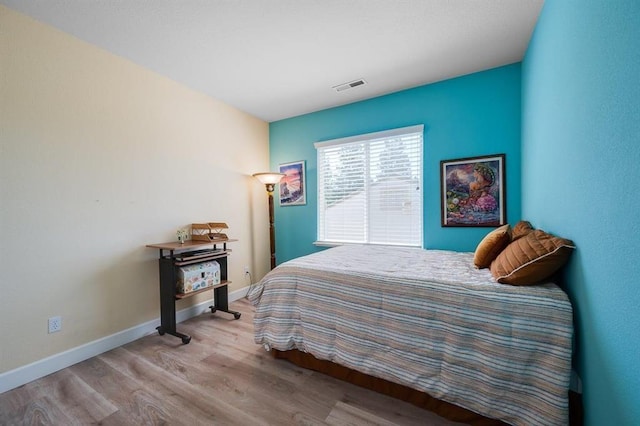 bedroom with light hardwood / wood-style flooring