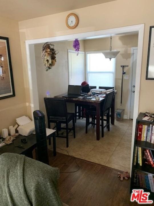 dining room with dark hardwood / wood-style floors