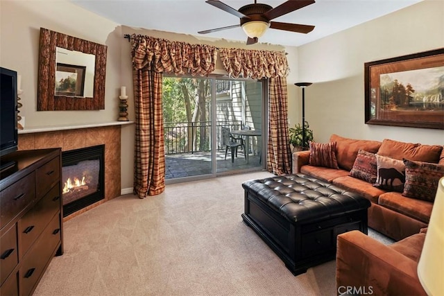 carpeted living room featuring ceiling fan