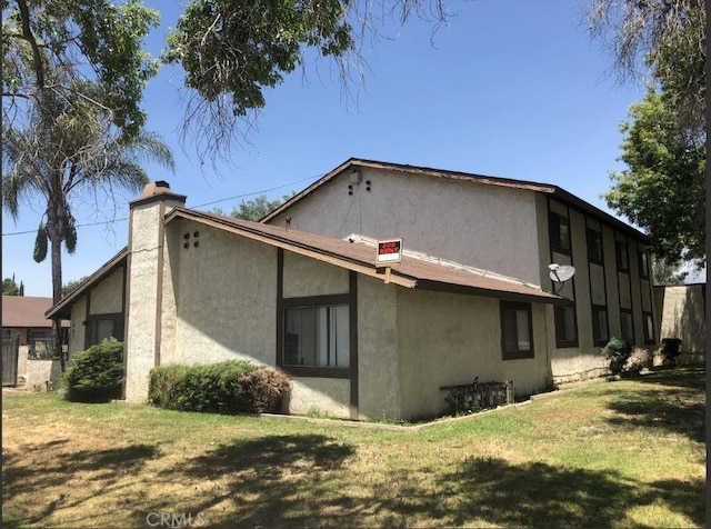 1097 Richland St, Upland, CA 91786 - rear view of property featuring a yard