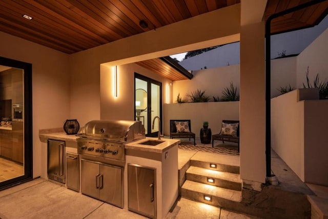 interior space featuring light tile flooring, wood ceiling, and sink