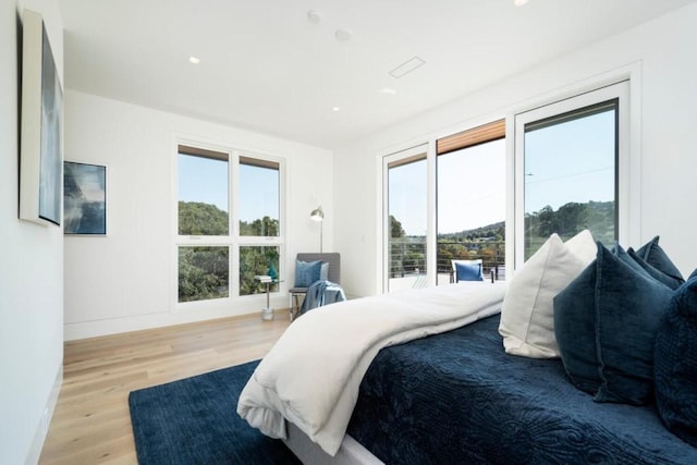 bedroom with light hardwood / wood-style floors