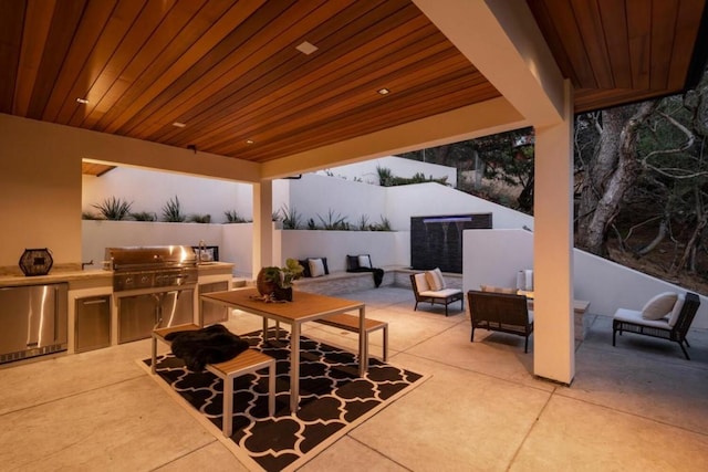 view of patio featuring area for grilling, outdoor lounge area, and a grill