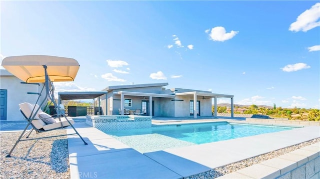 view of pool featuring an in ground hot tub and a patio area