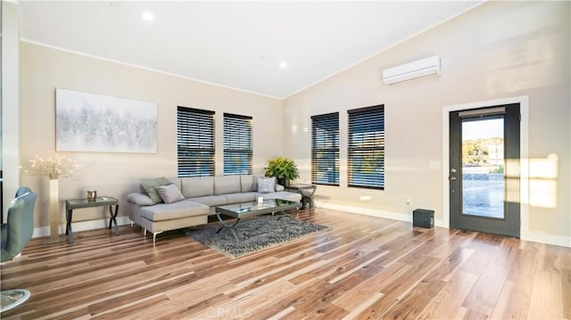 living room featuring high vaulted ceiling, a wall unit AC, crown molding, and hardwood / wood-style floors