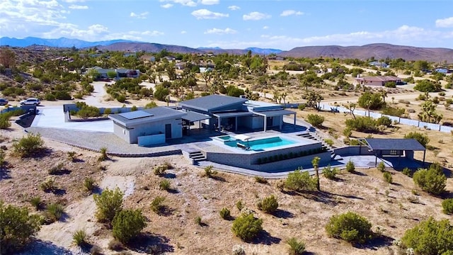 birds eye view of property featuring a mountain view