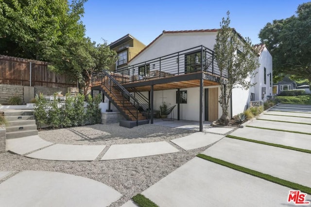 rear view of house with a patio