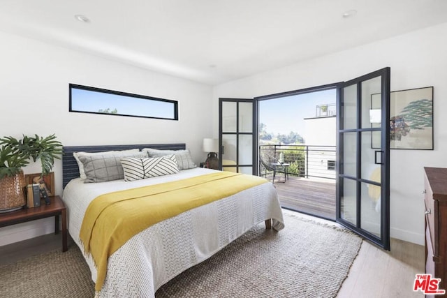 bedroom with light hardwood / wood-style flooring