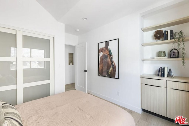 bedroom with light hardwood / wood-style flooring