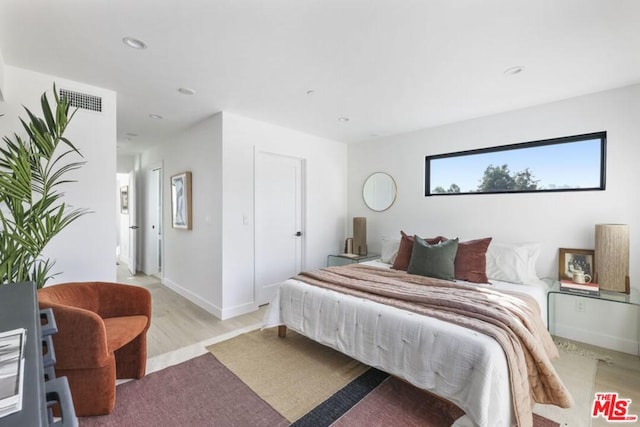 bedroom featuring light wood-type flooring