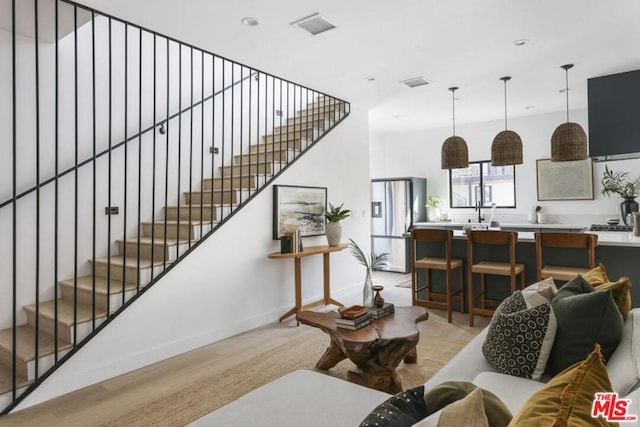 living room with light hardwood / wood-style flooring