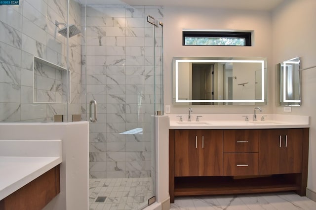 bathroom featuring tile floors, vanity with extensive cabinet space, double sink, and an enclosed shower