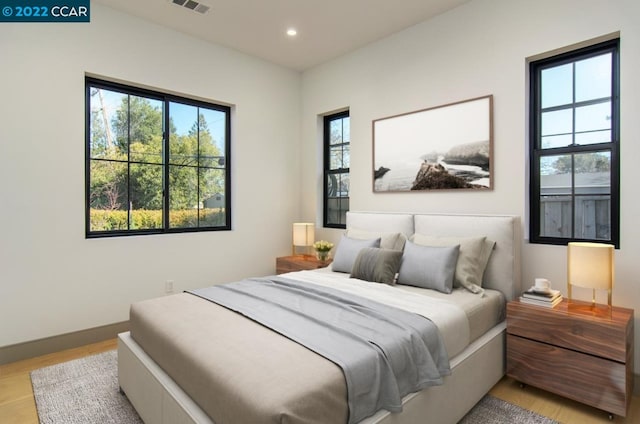 bedroom with light hardwood / wood-style flooring