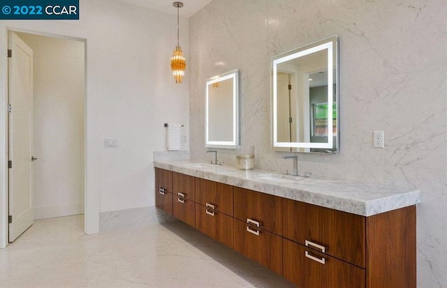 bathroom with dual sinks and large vanity