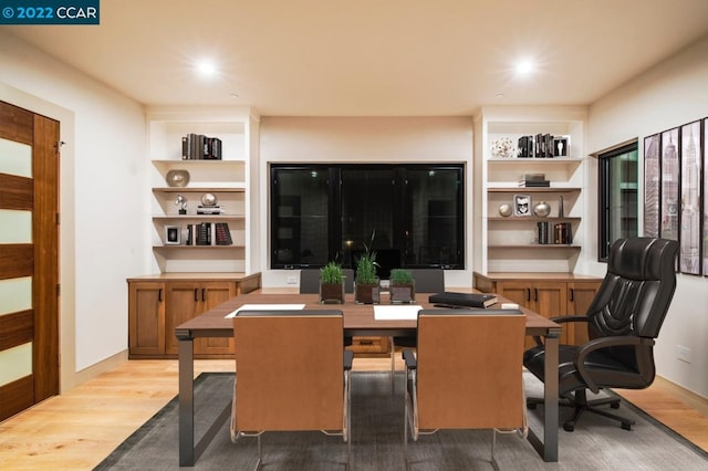 dining space with light hardwood / wood-style floors