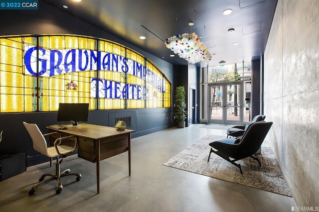 home office featuring concrete flooring