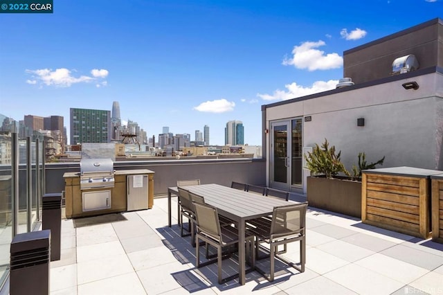 view of patio / terrace featuring area for grilling and exterior kitchen