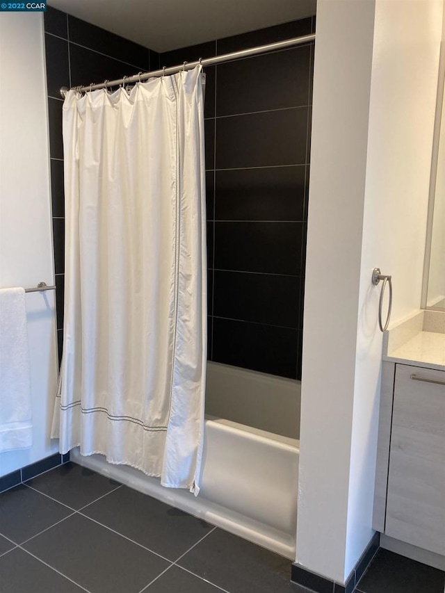 bathroom with tile patterned flooring and shower / bath combo