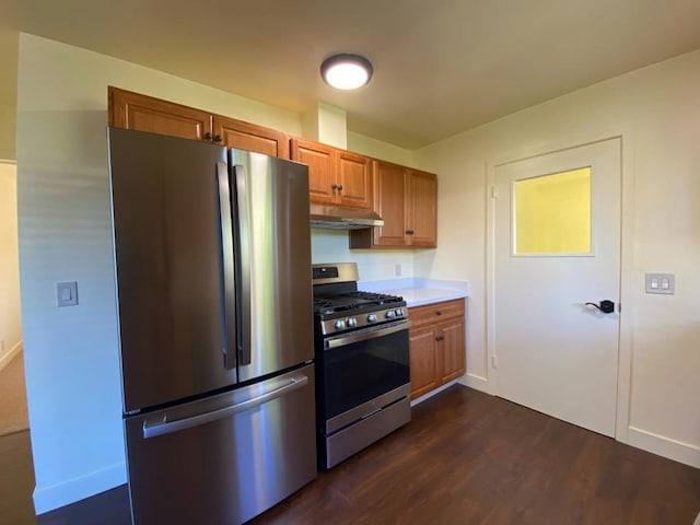 kitchen featuring dark hardwood / wood-style floors and appliances with stainless steel finishes