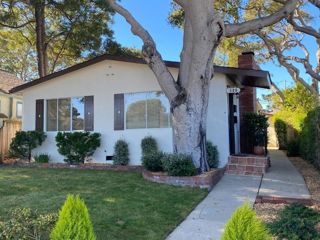 view of front of property with a front lawn