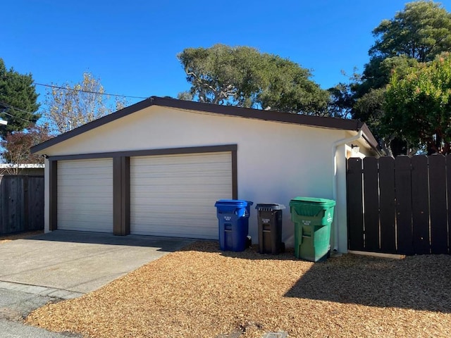 view of side of home featuring a garage