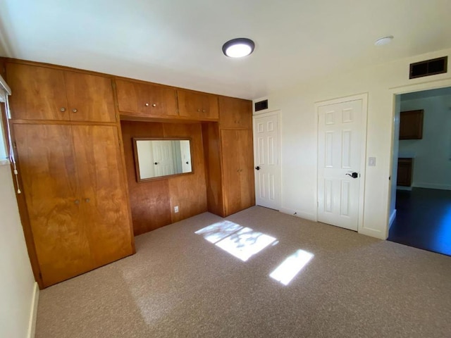 unfurnished bedroom featuring light colored carpet