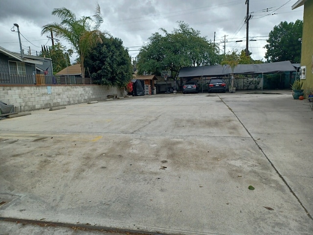 exterior space with a carport