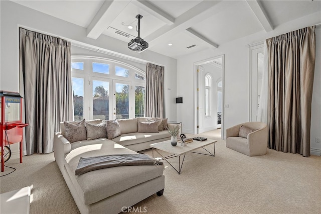 living room with light colored carpet, french doors, and beamed ceiling