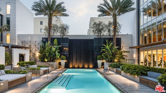 view of swimming pool featuring outdoor lounge area and a patio