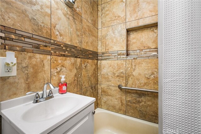 bathroom with shower / tub combination and vanity