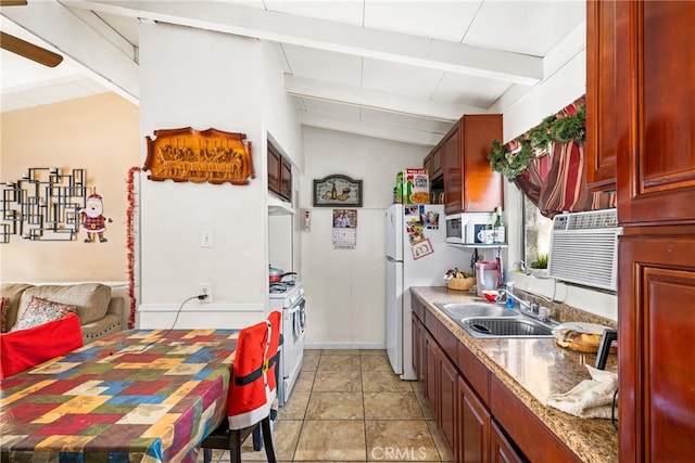 kitchen with vaulted ceiling with beams, light tile flooring, ceiling fan, white appliances, and sink