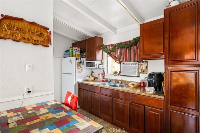 kitchen featuring light stone countertops, vaulted ceiling with beams, white fridge, sink, and light tile floors