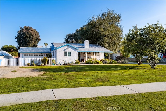 single story home with a front yard and a garage