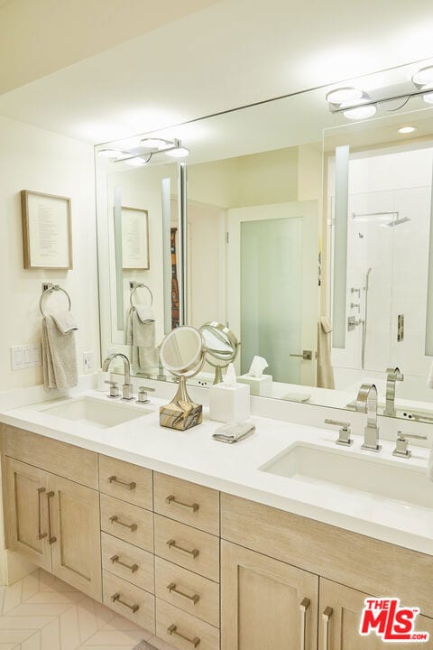 bathroom with tile flooring and double vanity