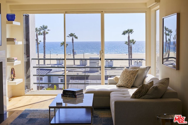 living room with a beach view and a water view