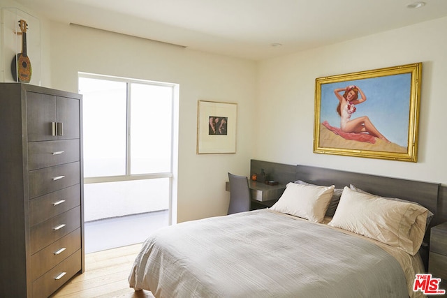 bedroom with light wood-type flooring