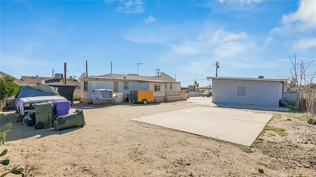 rear view of house featuring a patio area