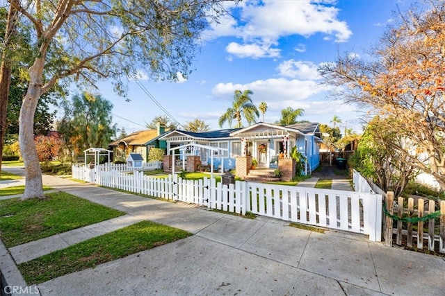 817 E Palmyra Ave, Orange, CA 92866 - view of front of home featuring a fenced front yard and a gate