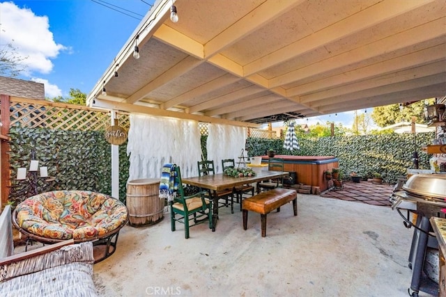 view of patio featuring a grill and a hot tub