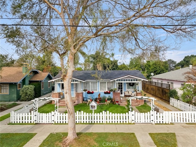 817 E Palmyra Ave, Orange, CA 92866 - view of front of house with an outdoor living space, a fenced front yard, and a patio