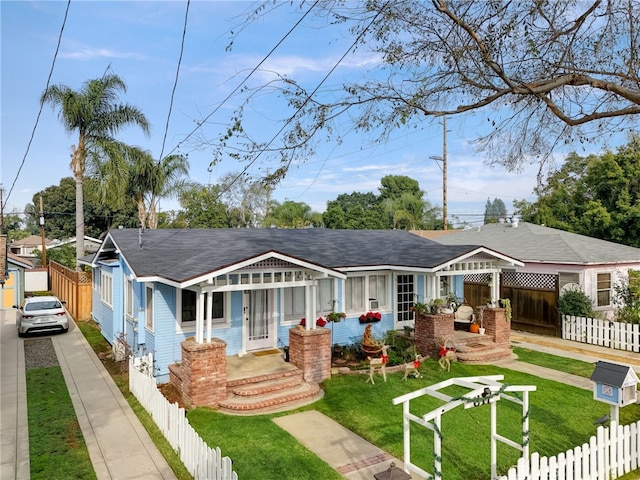 view of front of house with a porch and a front lawn