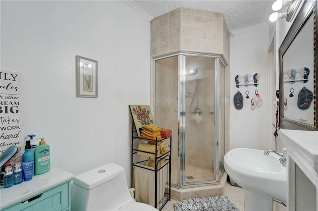 bathroom featuring tile patterned floors, toilet, crown molding, a textured ceiling, and a shower with door