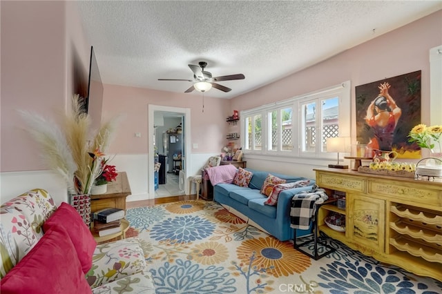 817 E Palmyra Ave, Orange, CA 92866 - living area featuring a ceiling fan and a textured ceiling