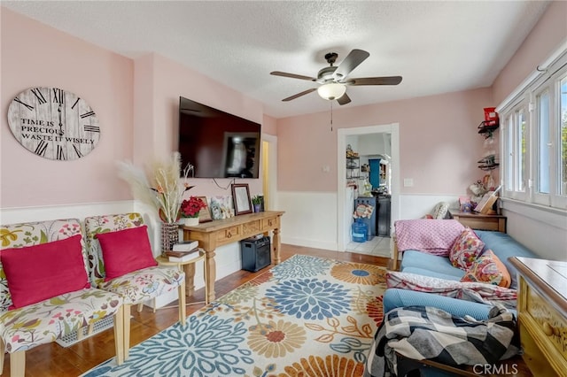 817 E Palmyra Ave, Orange, CA 92866 - living area with wood finished floors, ceiling fan, and a textured ceiling